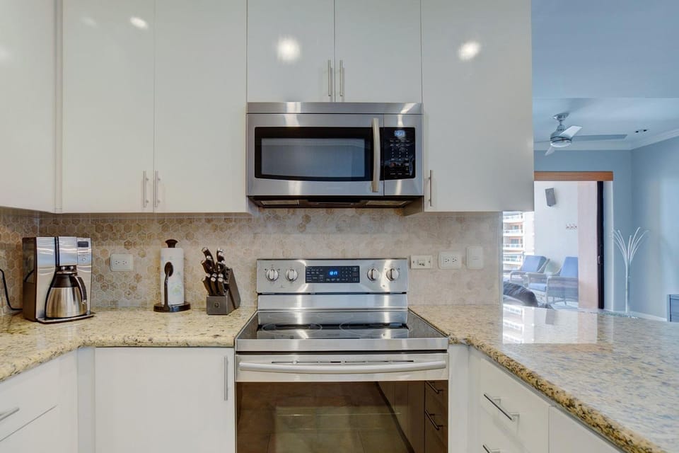 Samsung appliances and granite countertops in this spacious kitchen