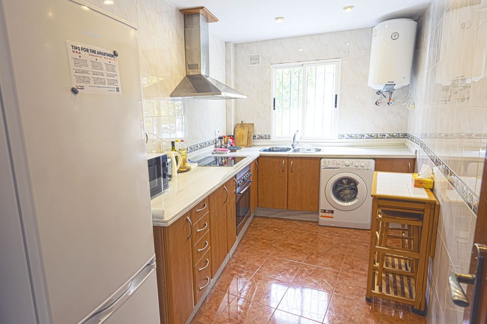 Our Kitchen features a Washer, Fridge+Freezer, Microwave, Oven, All Utensils...