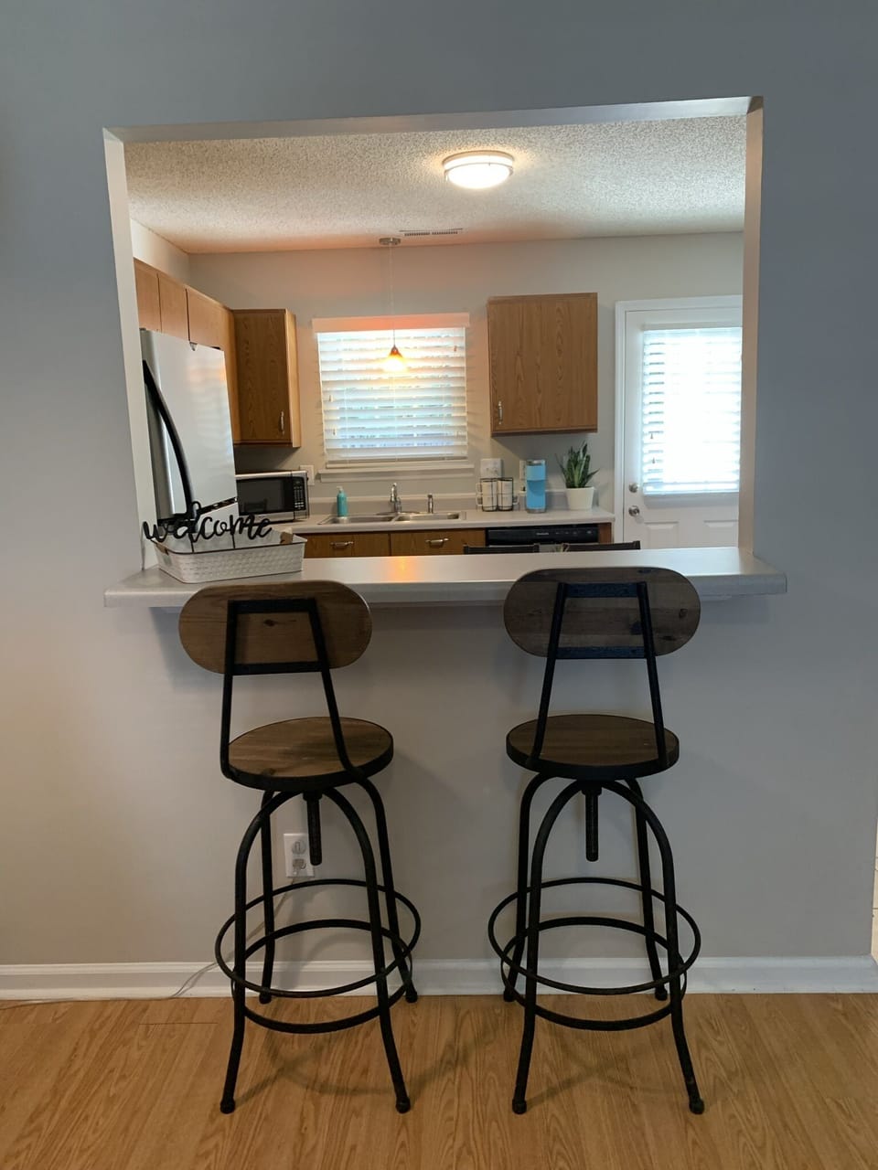 Two adjustable height bar stools. 
