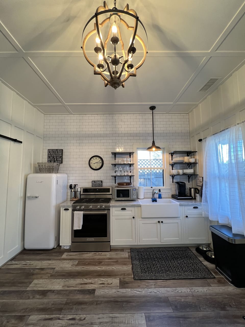 Functional and well stocked kitchen with retro style refrigerator