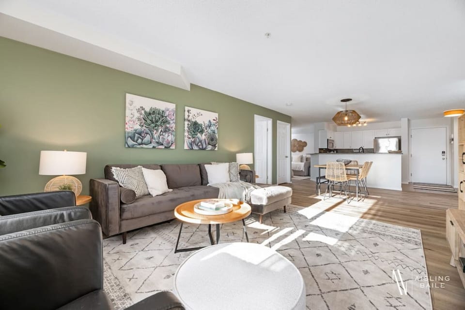 Living room with a Smart TV, Wii-U game console, cozy seating options and walkout access to the private ground-floor patio.