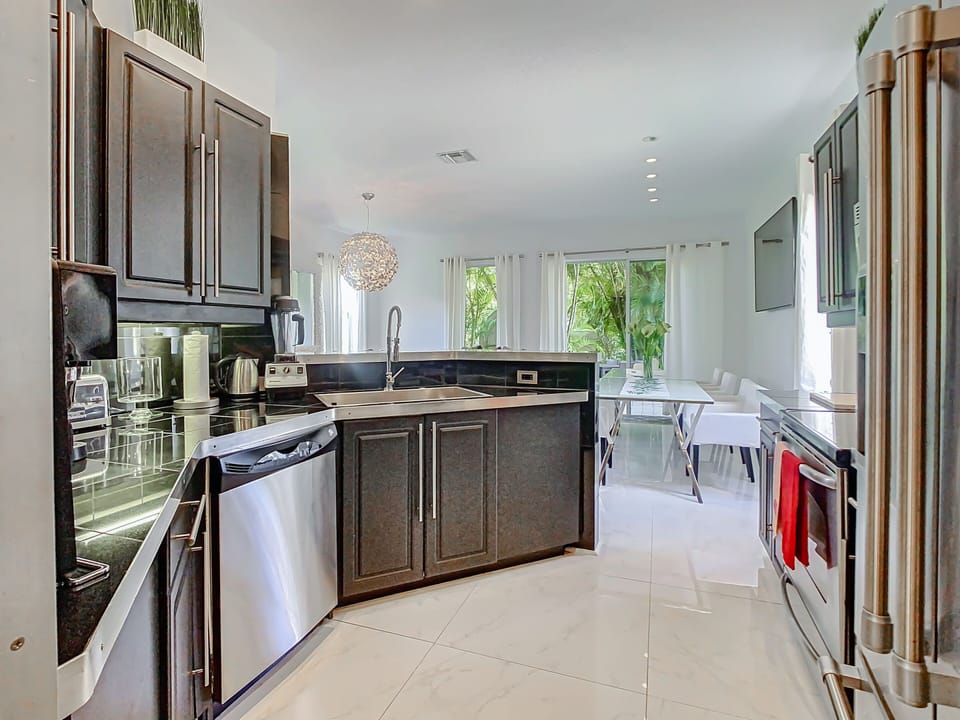Cook with style in our villa's sleek kitchen, with stainless steel appliances.