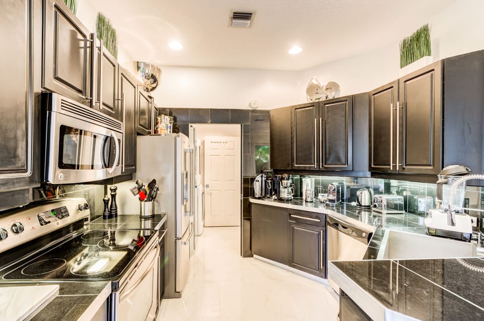 Cook with style in our villa's sleek kitchen, with stainless steel appliances.