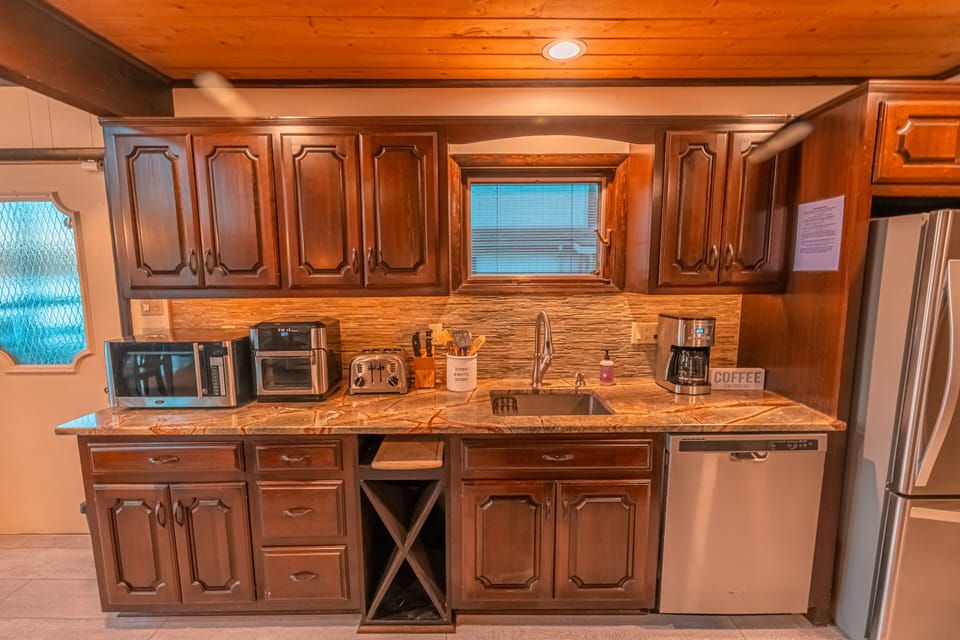 Stocked w/ utensils, pots/pans, air fryer, microwave, coffeemaker, toaster, etc.