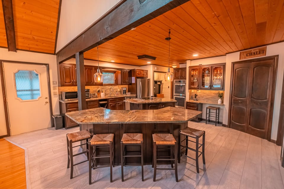 Updated kitchen with double islands and breakfast bar. Granite countertops.