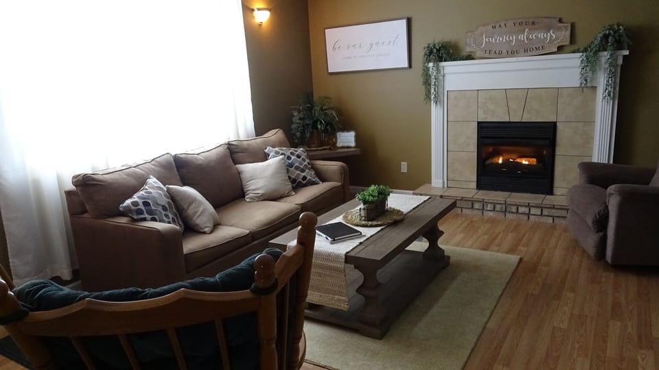 Living room offers a full size hideaway bed and fireplace.
