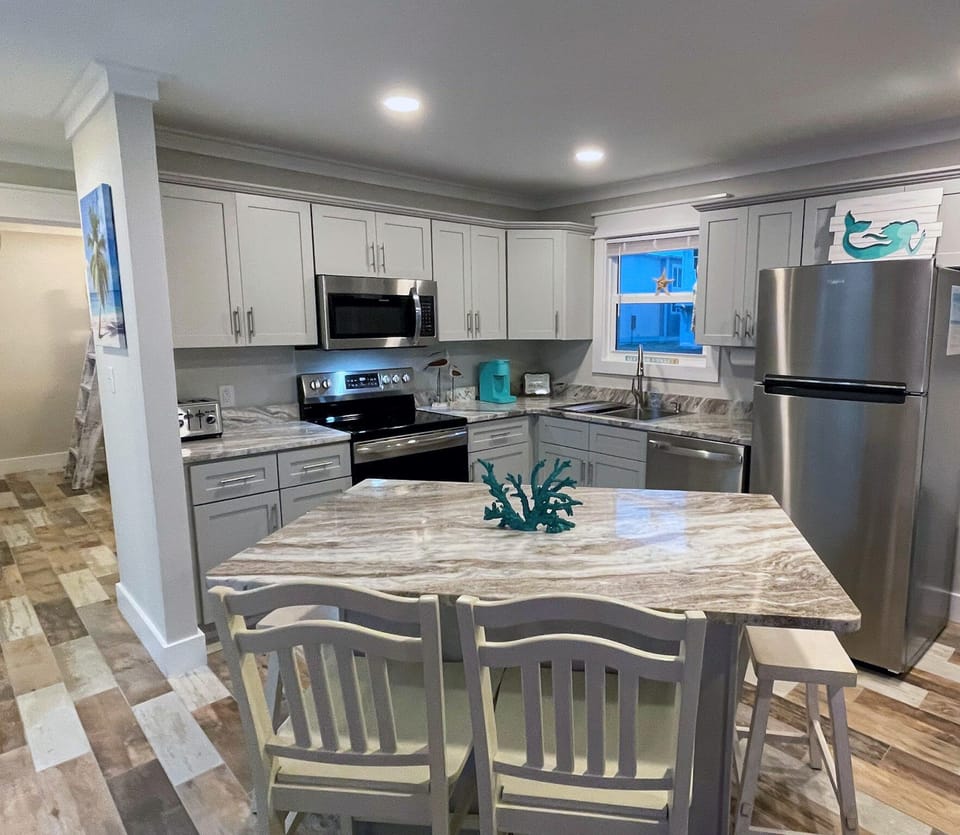 New Beautiful kitchen with Stainless Steel appliances and granite countertops.  