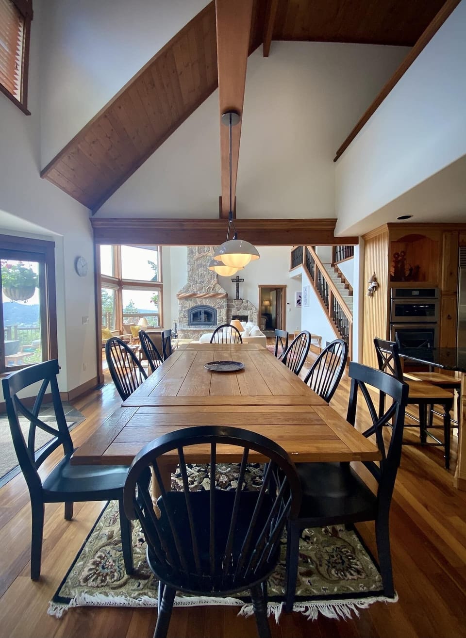 Dining room looks out to the living room and fireplace creating a warm and connected experience.