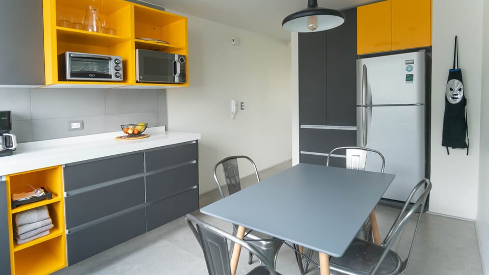 The kitchen has an eat-in table and is fully equipped with nice cookware 