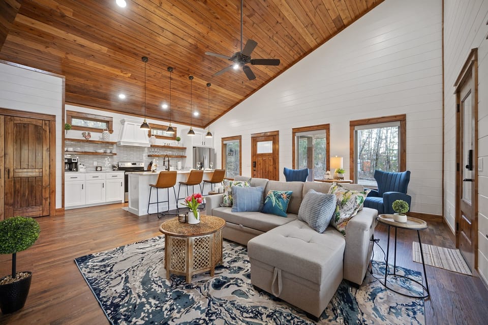 Living Room: Bright and airy space with stunning wood accents and inviting seating for great gatherings!