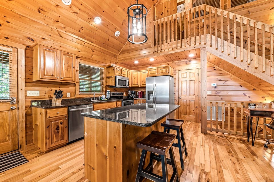 Fully Stocked Kitchen with plenty of counter space, including a large island.  Starter paper towel, dish soap, dishwasher pods are provided. Please bring your own coffee, filters and cream/sug