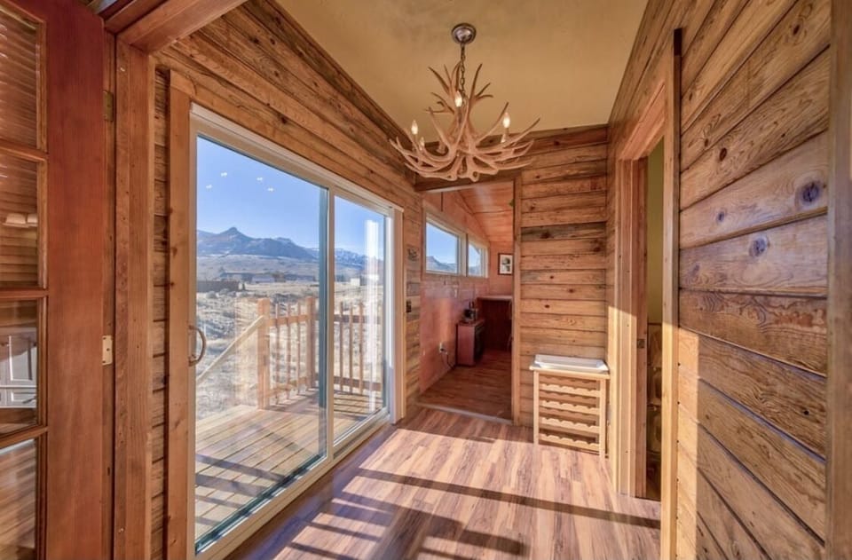 Bright and sunny hallway leading to Bedroom 1 and Full bath