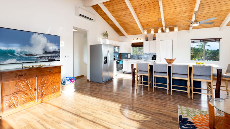 Kitchen and living room as you walk in on the top floor.  Open concept.