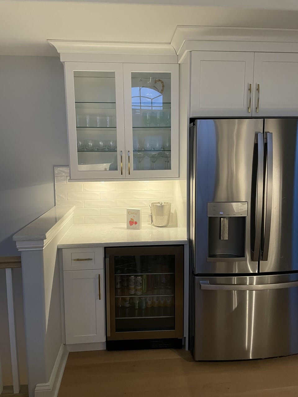 Mini beverage cooler and drink area.