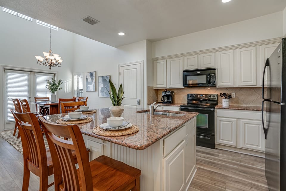 Large kitchen island The kitchen is well stocked for all your needs.
