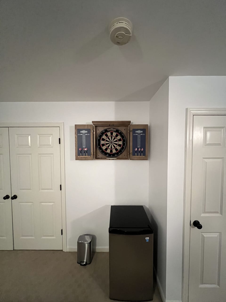 dart board with mini fridge