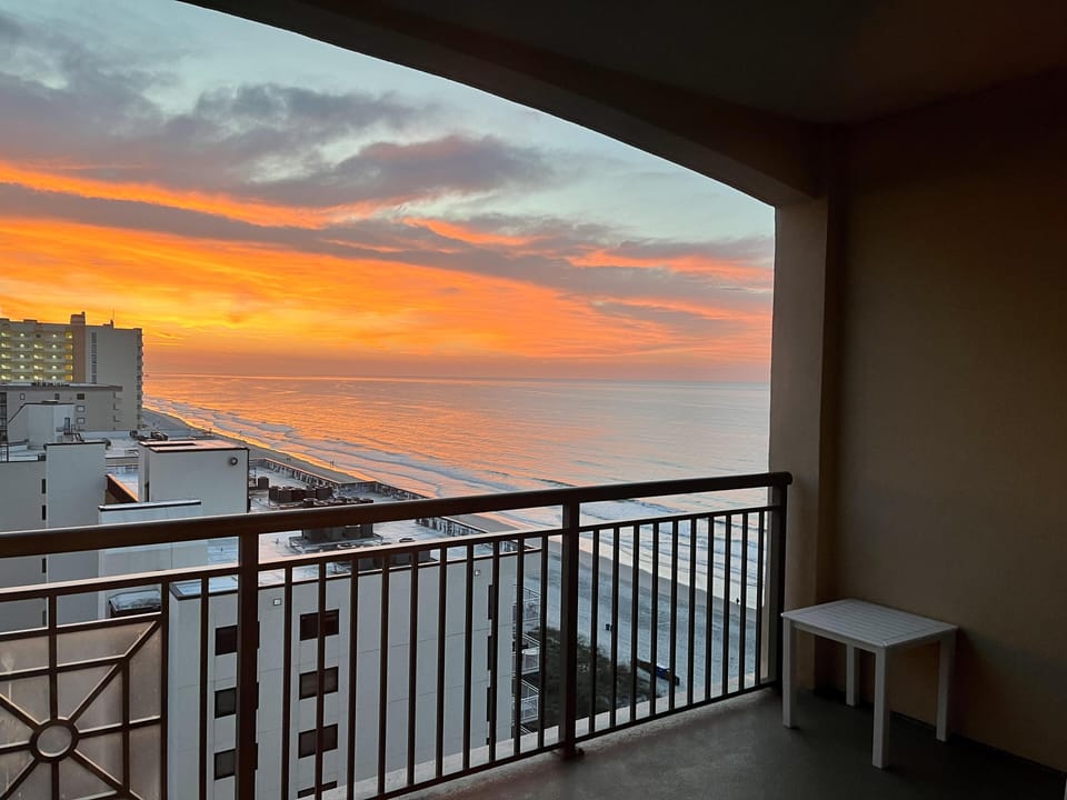 Sunset views from a cozy balcony retreat