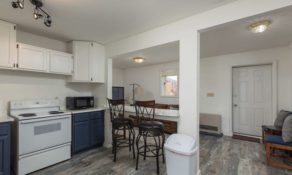 Back door access from living room directly into common, coin-op lanundry