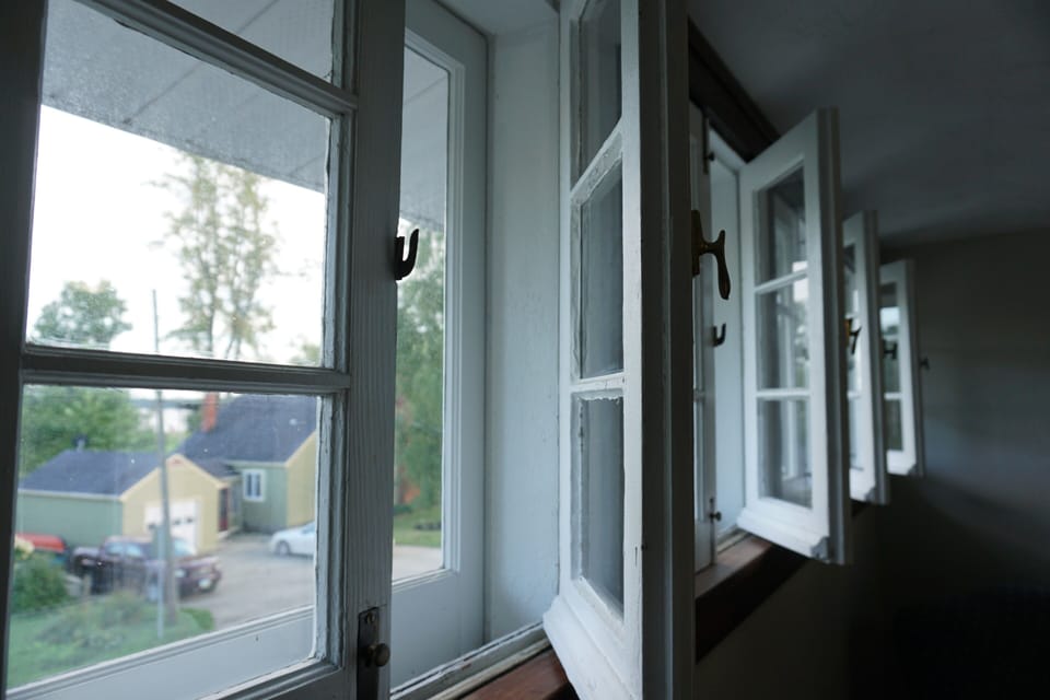 Beautiful original windows in upstairs queen bedroom.