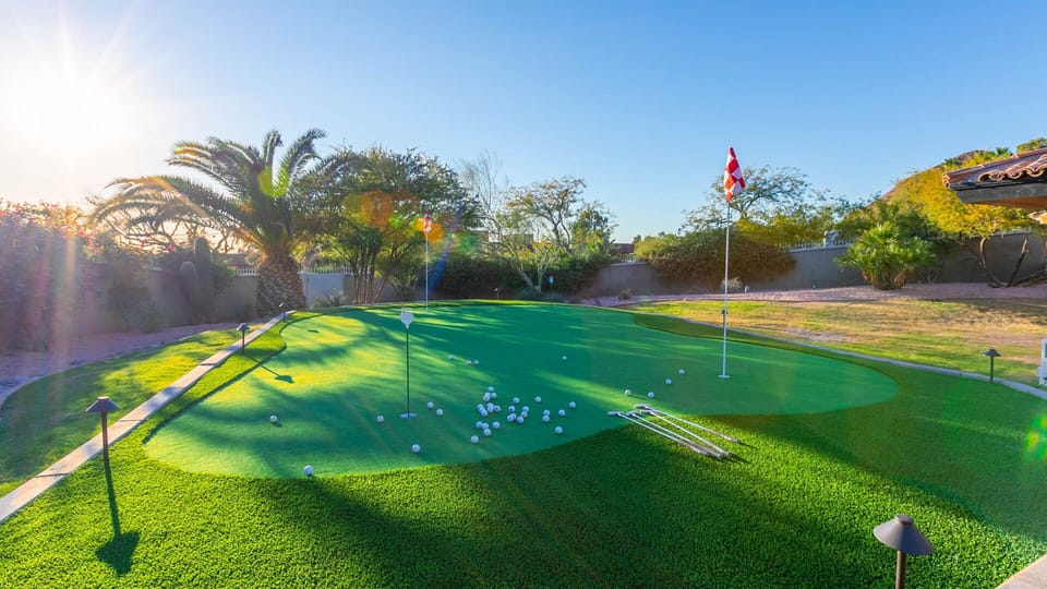 Sunny backyard putting green for even more outdoor fun
