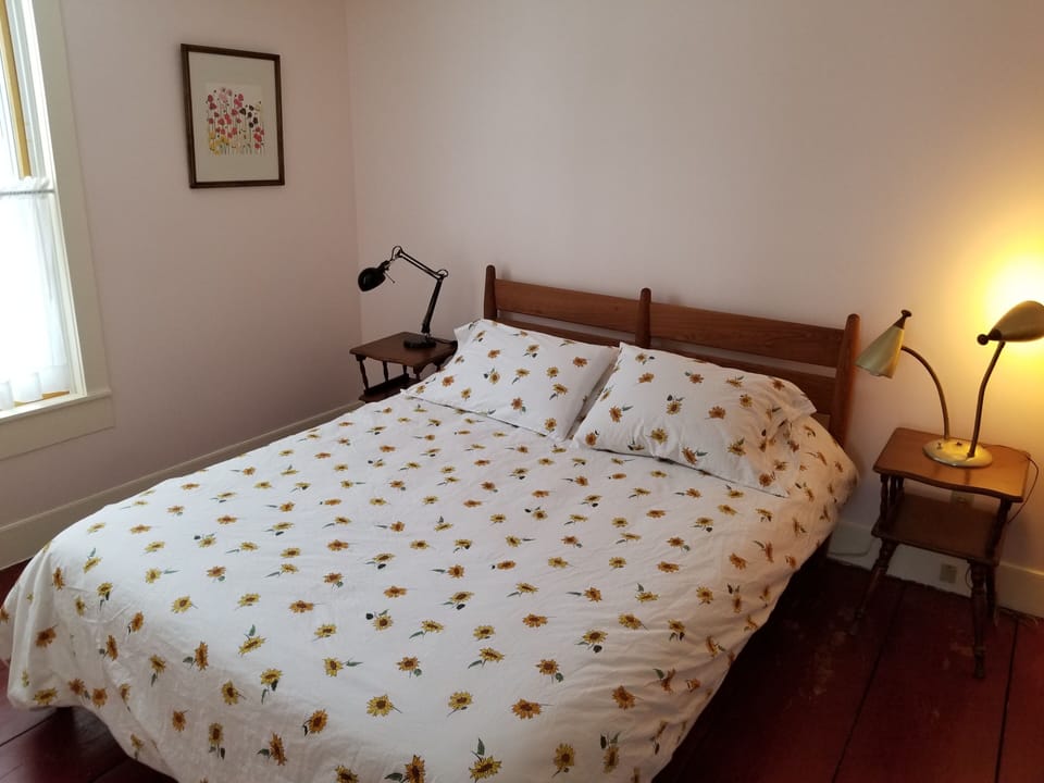 Bedroom 1 on the first floor with queen bed.