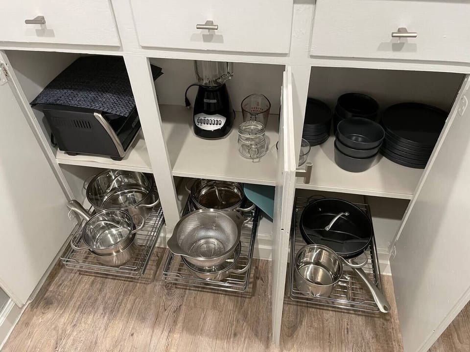 Fully stocked kitchen - equipped with Keurig, coffee pods, French Press, microwave, toaster oven, blender, Brita water pitcher and full set of cookware and dinnerware. 