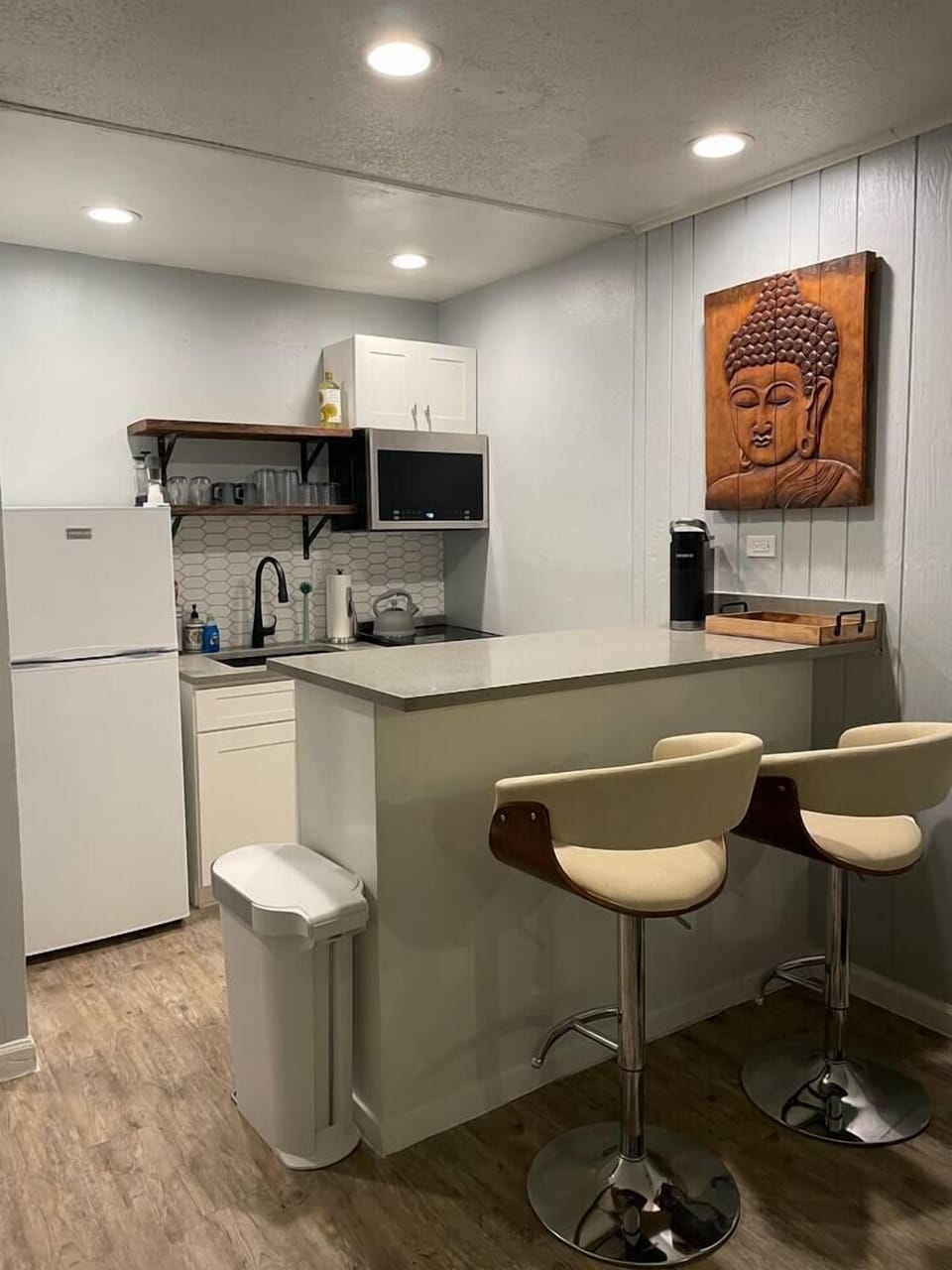 Fully stocked kitchen - equipped with Keurig, coffee pods, French Press, microwave, toaster oven, blender, Brita water pitcher and full set of cookware and dinnerware. 