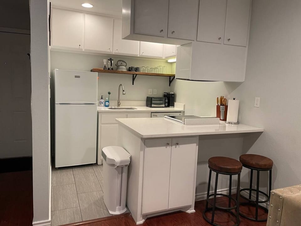Fully stocked kitchen - equipped with Keurig, coffee pods, French Press, microwave, toaster oven, blender, Brita water pitcher and full set of cookware and dinnerware. 