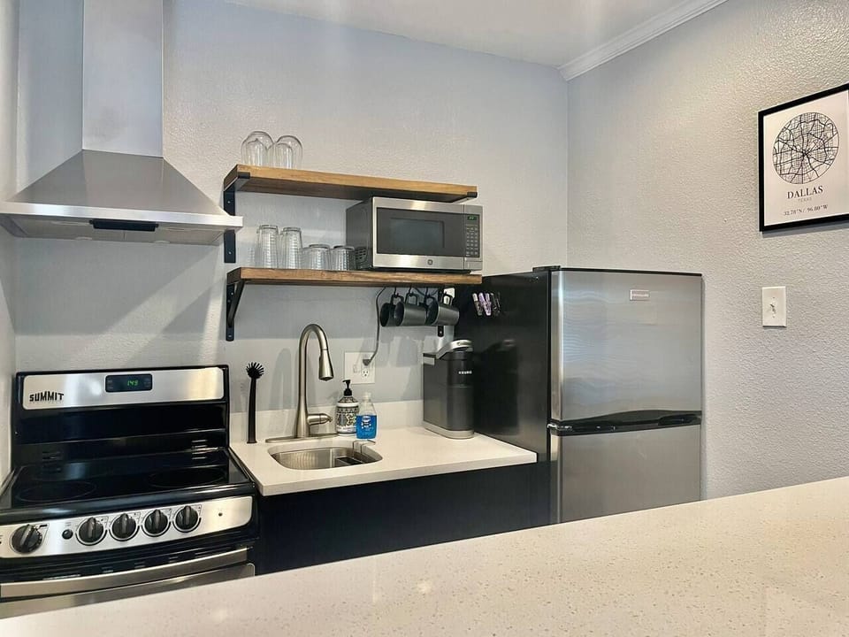 Fully stocked kitchen - equipped with Keurig, coffee pods, French Press, microwave, toaster oven, blender, Brita water pitcher and full set of cookware and dinnerware. 