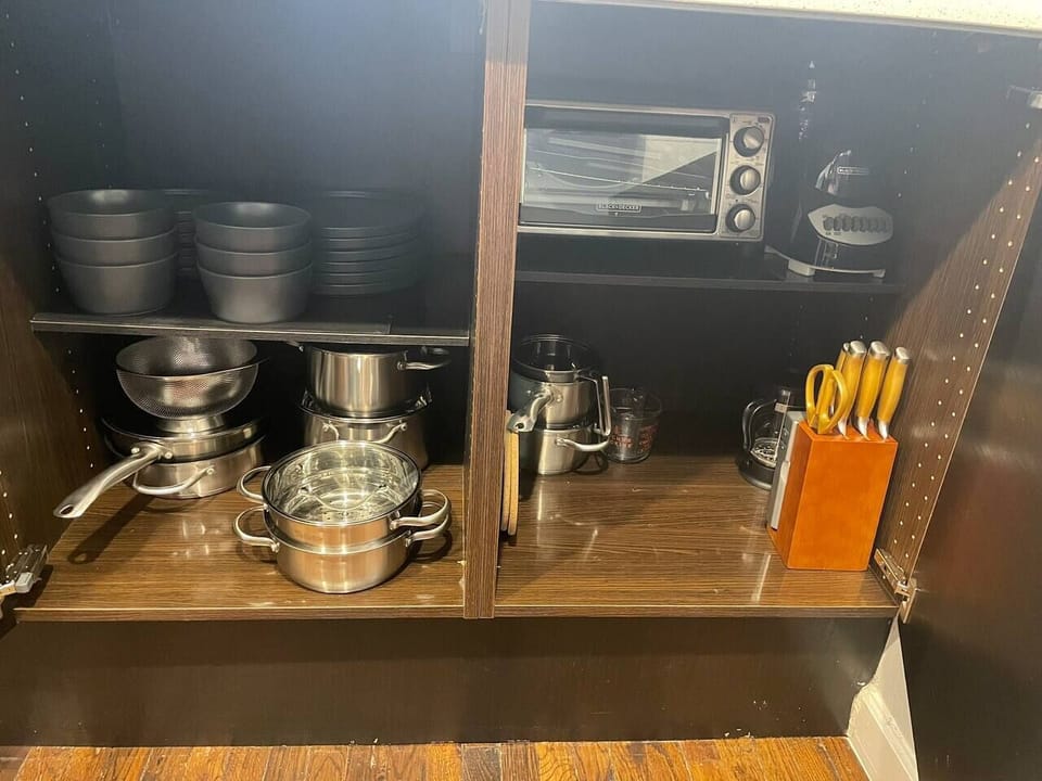 Fully stocked kitchen - equipped with Keurig, coffee pods, French Press, microwave, toaster oven, blender, Brita water pitcher and full set of cookware and dinnerware. 