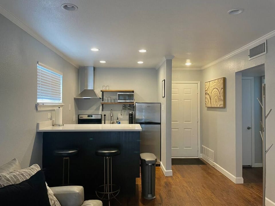 Fully stocked kitchen - equipped with Keurig, coffee pods, French Press, microwave, toaster oven, blender, Brita water pitcher and full set of cookware and dinnerware. 