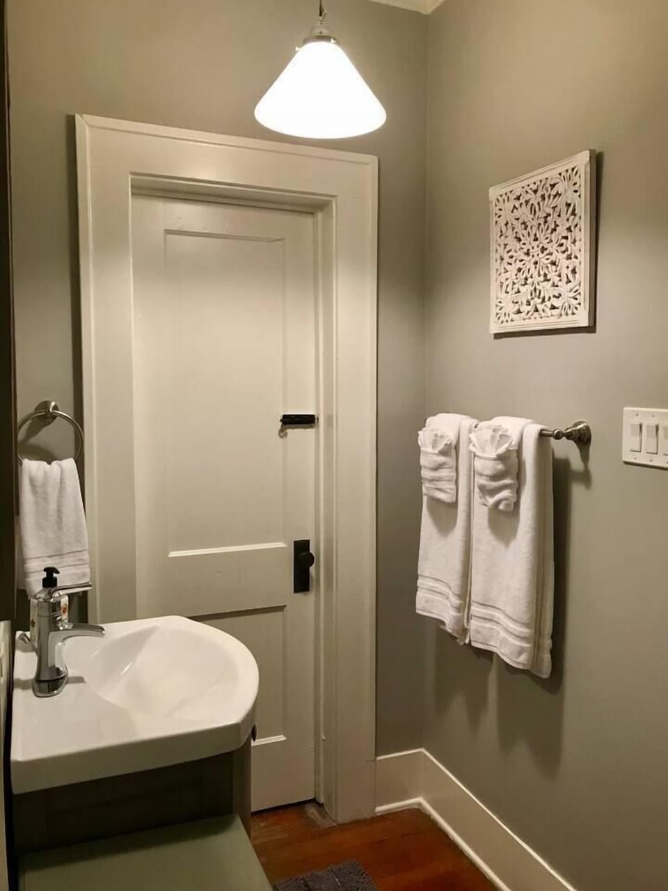 Spacious front bathroom boasts a standup shower equipped with plenty of fresh linens, hair dryer, q-tips, makeup and makeup towels. 