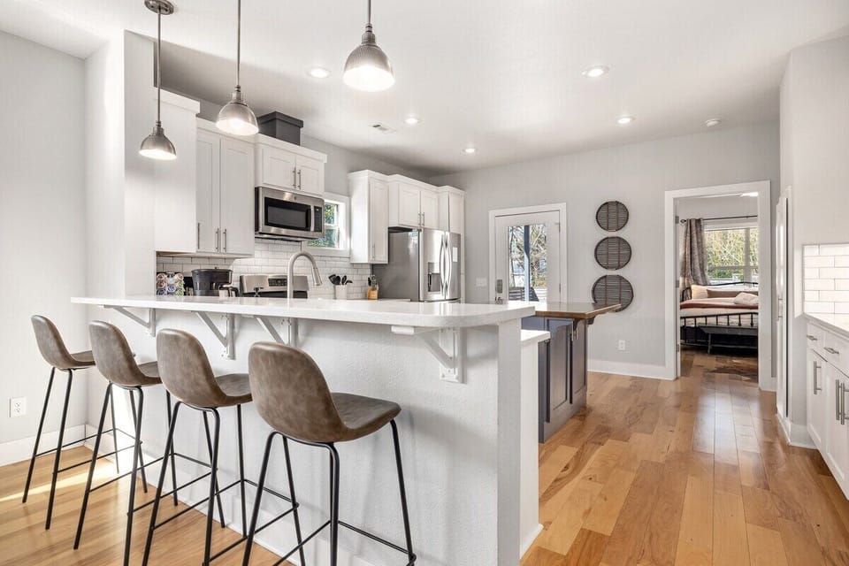 Here, you'll also find our bar and four barstools, which look into the kitchen.