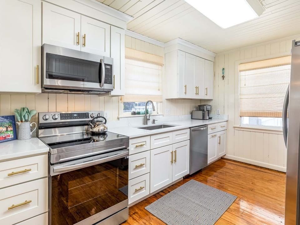 Updated galley kitchen with all stainless steel appliances.