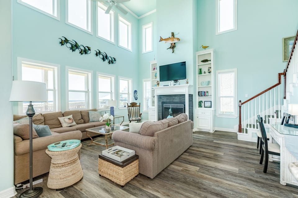 Wall of windows in the bright and airy living room
