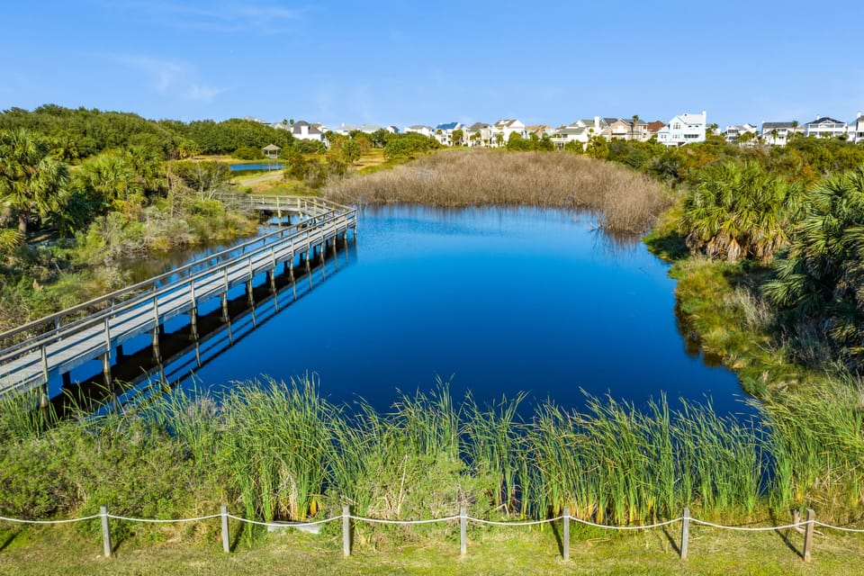 Enjoy a scenic walk along the boardwalk at Lafitte's Cove Nature Preserve.