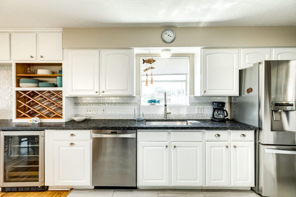 Fully equipped kitchen with stainless steel appliances and abundant storage