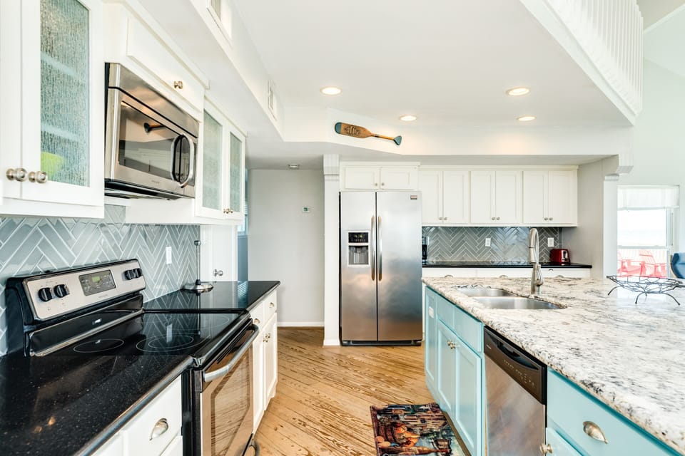 Spacious kitchen, perfectly equipped with stainless steel appliances