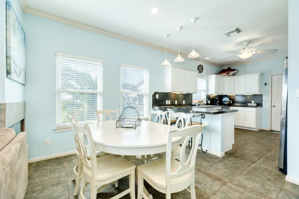 Adjacent breakfast bar has seating for 2 more