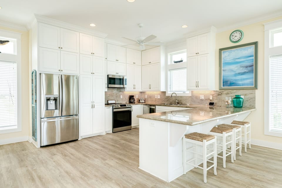 Grab a bite to eat at the breakfast bar with seating for 4