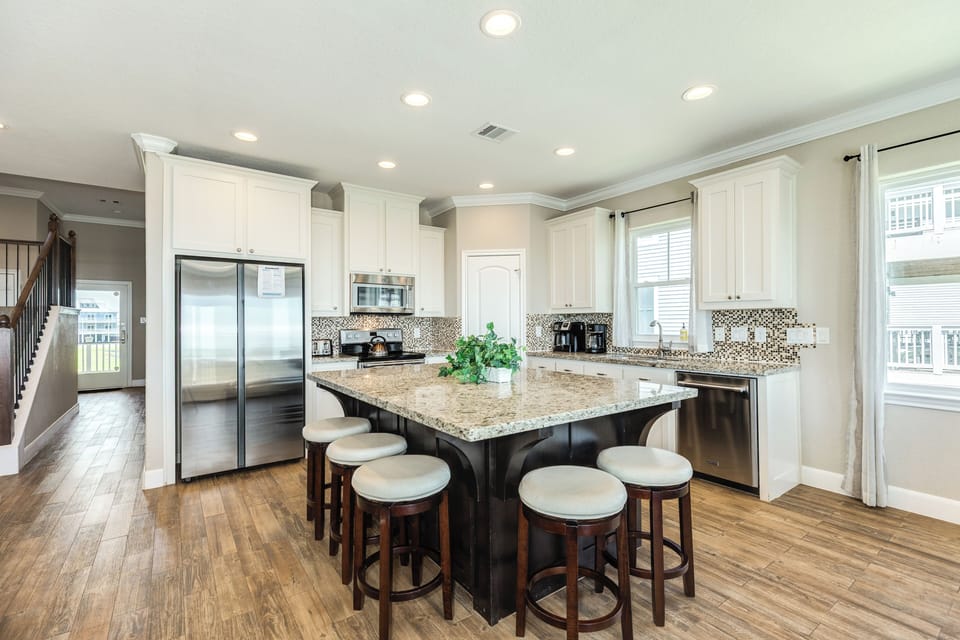 Oversized kitchen island is great for snacking or serving meals