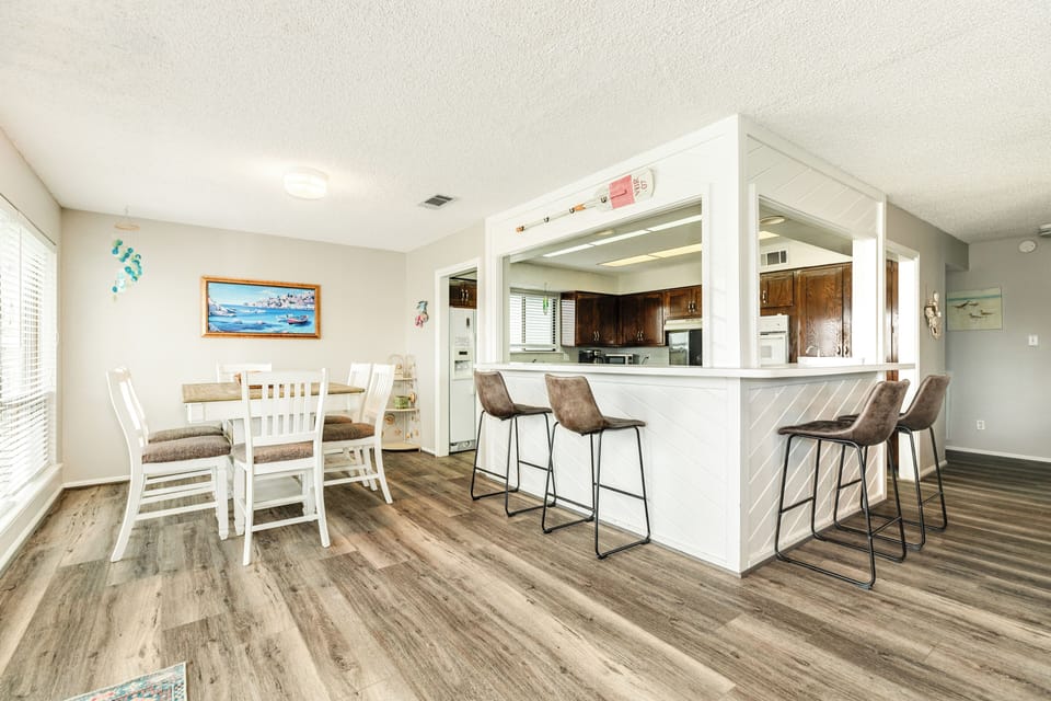 Grab quick bites or enjoy meals at the breakfast bar with seating for 4