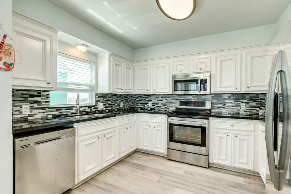 Fully equipped kitchen includes stainless steel appliances