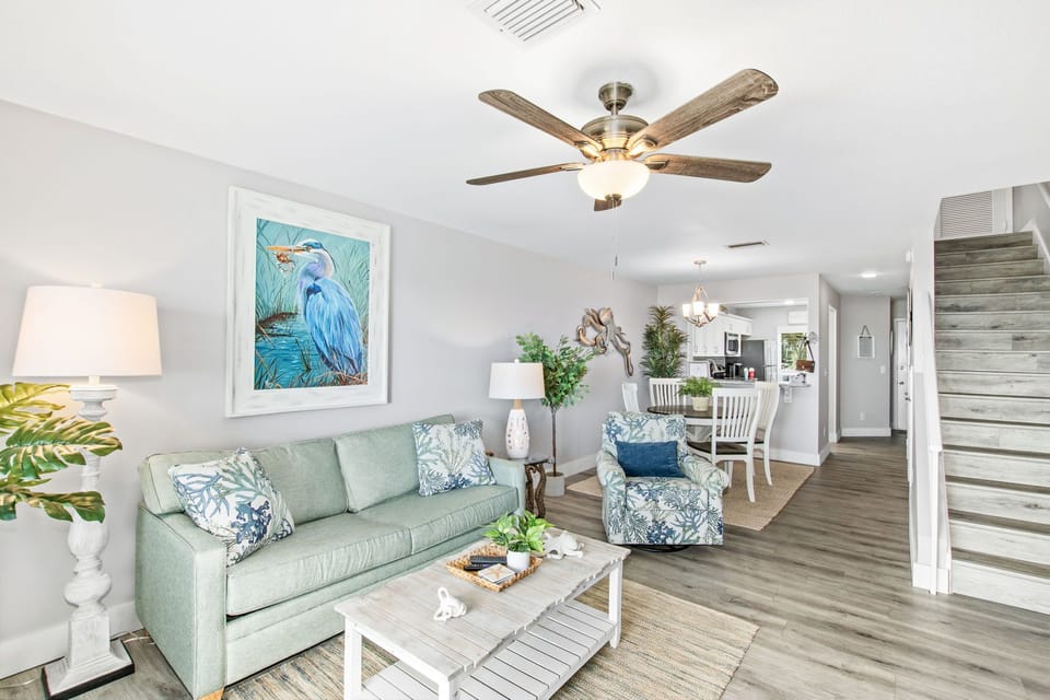 Stairs in the townhome lead to both bedrooms, full bathrooms & washer/dryer