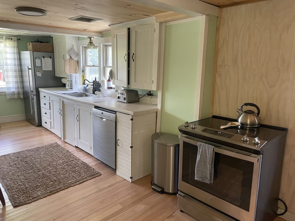 Kitchen with electric range and dishwasher