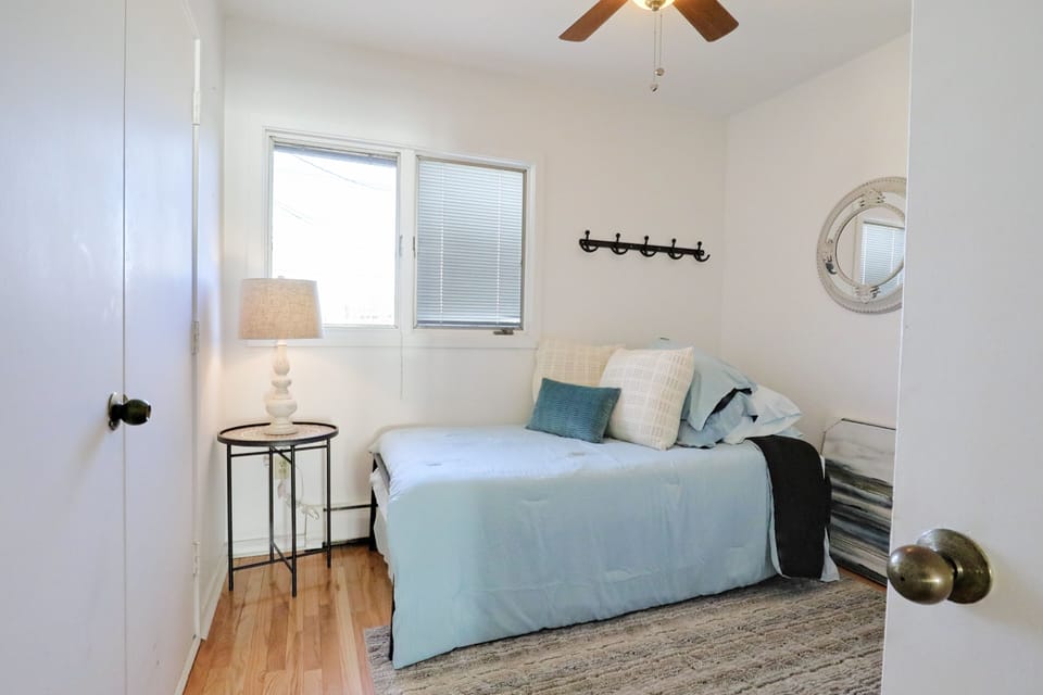Back bedroom on the first floor with a twin bed and a trundle bed.  