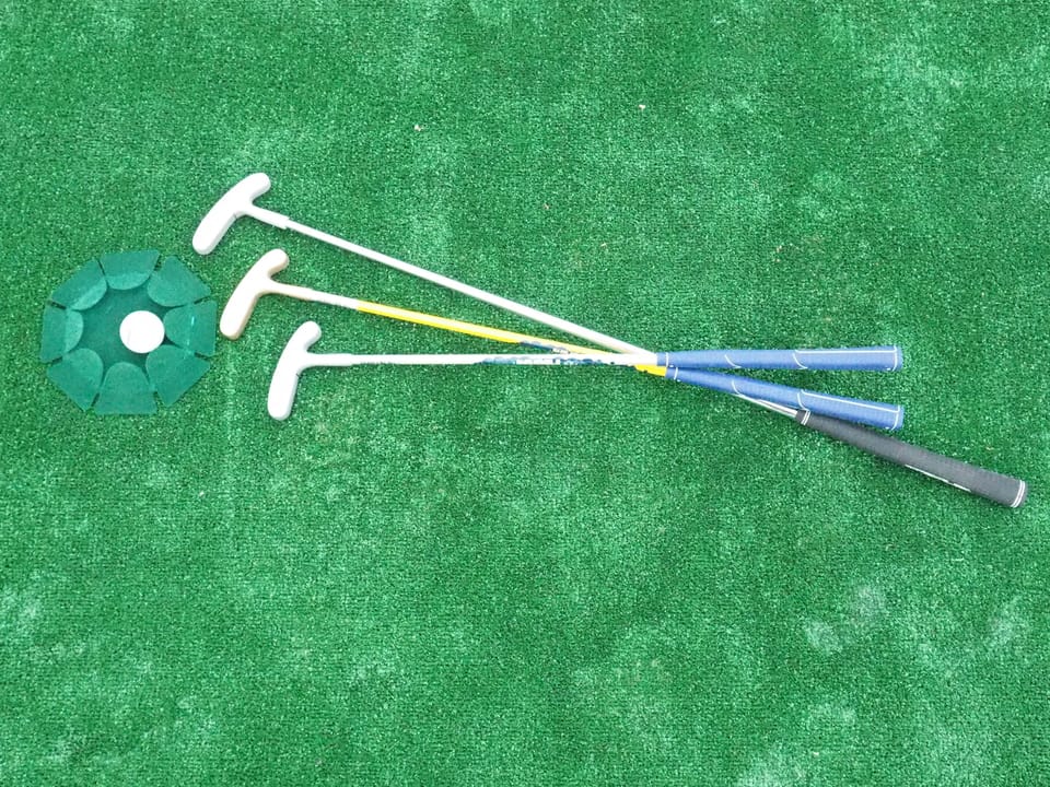 Mini golf set great for playing on our golf turf in back portion of roof deck 