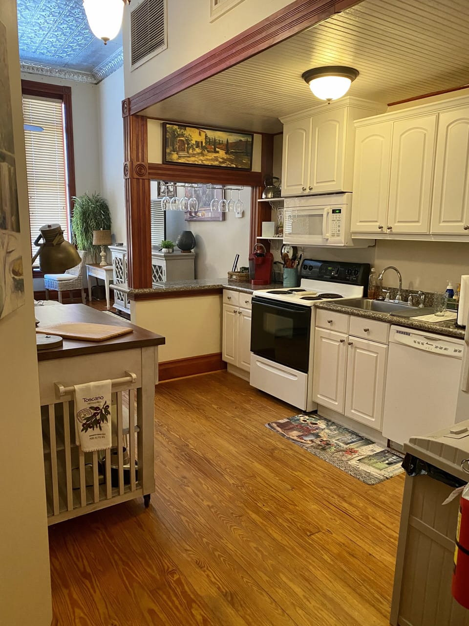Kitchen includes stove, dishwasher, microwave and refrigerator.