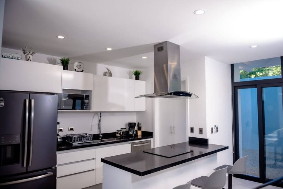 Modern kitchen with a counter table for casual dining.