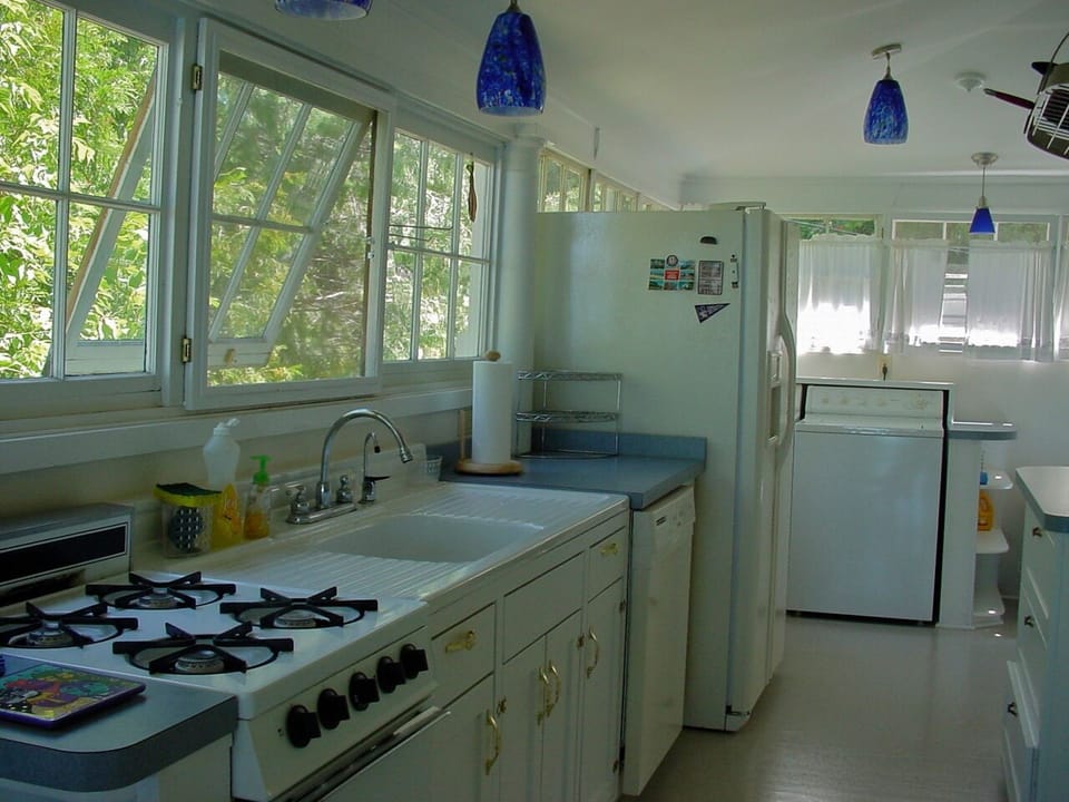Galley kitchen with stove, dishwasher, fridge w/ ice/water. Washer & dryer.